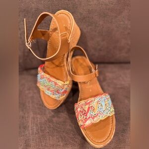 Wedge sandle with woven heel and pastel woven upper.